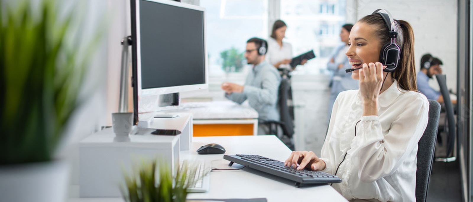Intake coordinator on a headset answering a call about home health coverage